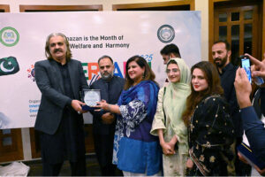 Chief Minister of Khyber Pakhtunkhwa Sardar Ali Amin Gandapur giving away shield of honour to the members of International Research Council for Religious Affairs on their service to humanity, promoting peace and interfaith harmony at "Interfaith Iftaar Dinner".