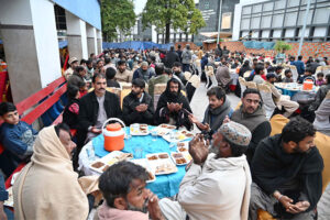 A large number of people offering Dua before breaking their fast at Allama Iqbal Memorial Teaching Hospital