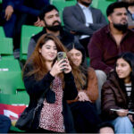 Spectators enjoying the ICC Champions Trophy one-day international (ODI) Semi-Final cricket match between New Zealand and South Africa at the Gaddafi Stadium