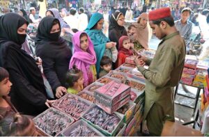 A vendor displaying and selling bangles at Urdu Bazaar.