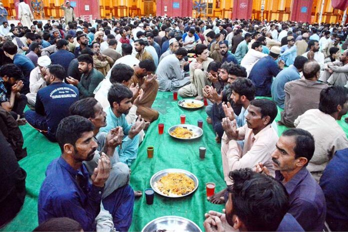 A large number of faithful offering dua before break their fast at New Memon Masjid on the first day of holy fasting month of Ramazan