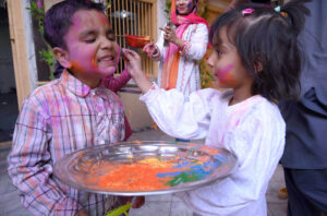 Hindu community celebrating Holi, the Hindu Festival of color organized by Hum Log at Kala Bari Mandir.