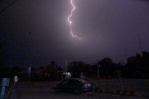 A view of lightning striking in the sky at night