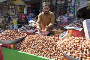 A vendor selling Dates on his cart at Muslim Bazar