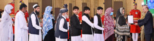 The next-of-kin of the martyrs receiving the awards of Hilal-i-Shuja'at from President Asif Ali Zardari at the investiture ceremony to confer the insignias of civil awards, at Aiwan-e-Sadr.