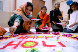 Hindu community celebrating Holi, the Hindu Festival of color organized by Hum Log at Kala Bari Mandir.