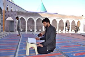 A faithful is reciting the Holy Quran in Jamia Masjid Minhaj-ul-Quran during the holy fasting month of Ramzan-ul-Mubarak.