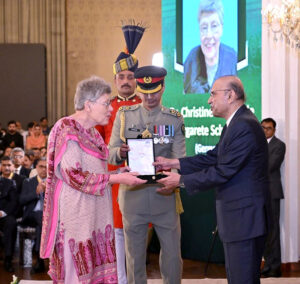 President Asif Ali Zardari conferring the award of Sitara-i-Quaid-i-Azam upon Dr Christine Brunhilde Margarete Schmotzer in recognition of her services to Pakistan, at the investiture ceremony to confer the insignias of Civil Awards, at Aiwan-e-Sadr.