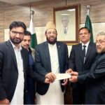 Federal Minister for Religious affairs and inter-faith Harmony Sardar Muhammad Yusuf presenting grant cheque to the representatives of District Bar Association Mansehra.