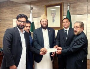 Federal Minister for Religious affairs and inter-faith Harmony Sardar Muhammad Yusuf presenting grant cheque to the representatives of District Bar Association Mansehra.