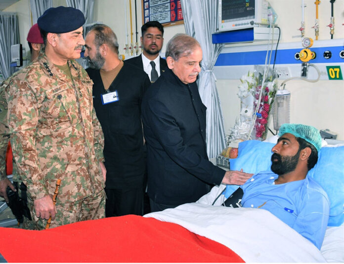 Prime Minister Muhammad Shehbaz Sharif and Chief of Army Staff General Syed Asim Munir (NIM) meeting with soldiers who got injured in Jaffar Express hijack operation