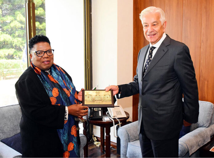 Federal Minister for Defence, Khawaja Muhammad Asif presenting a souvenir to Dr. Thobekile Gamede, Acting Secretary of Defence of South Africa