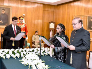 Acting President, Syed Yousuf Raza Gillani administering the oath of office of the Federal Minister to Syed Imran Ahmad Shah, during an oath-taking ceremony, at Aiwan-e-Sadr